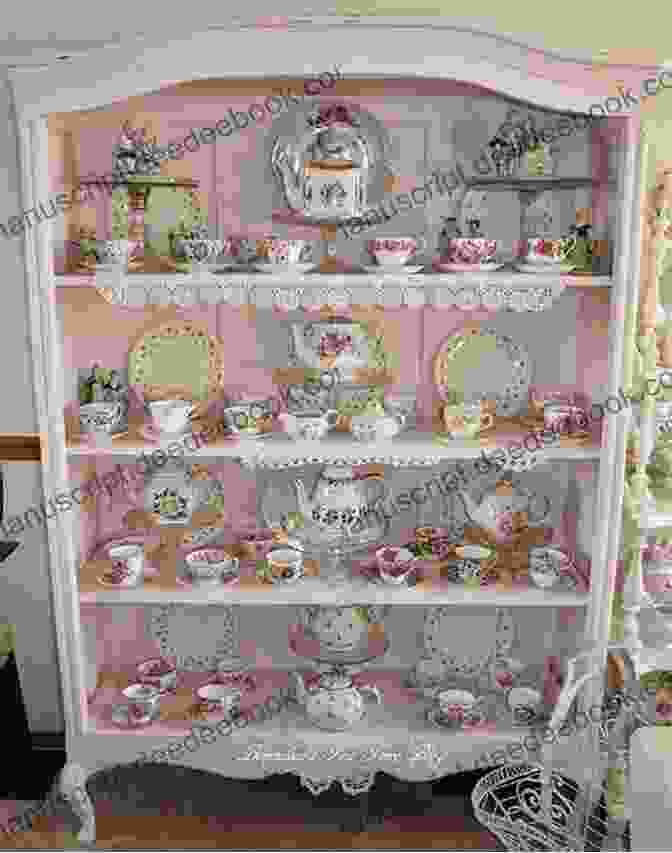 A Cozy Corner Of The Tea Shop, Featuring A Display Of Exquisite Teacups And A Table Set For Tea And Quilting The Quilting Bee: A Romance By The Sea (Quilting Bee Tea Shop 1)