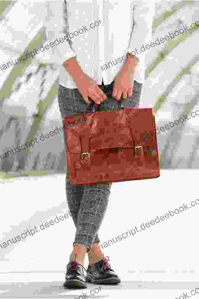 A Woman Holding A Brown Leather Bag LEATHER CRAFTING FOR BEGINNERS: Learn How To Make Leather Bags As A Complete Novice